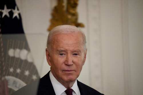 A political figure speaking at a formal event in the White House