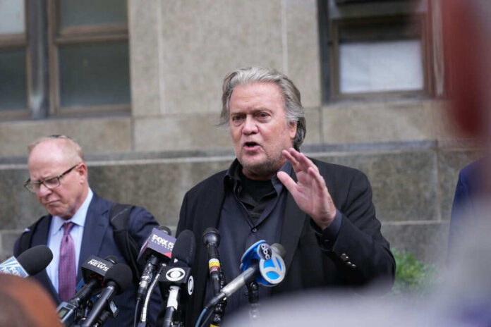 Man speaking at press conference in front of microphones