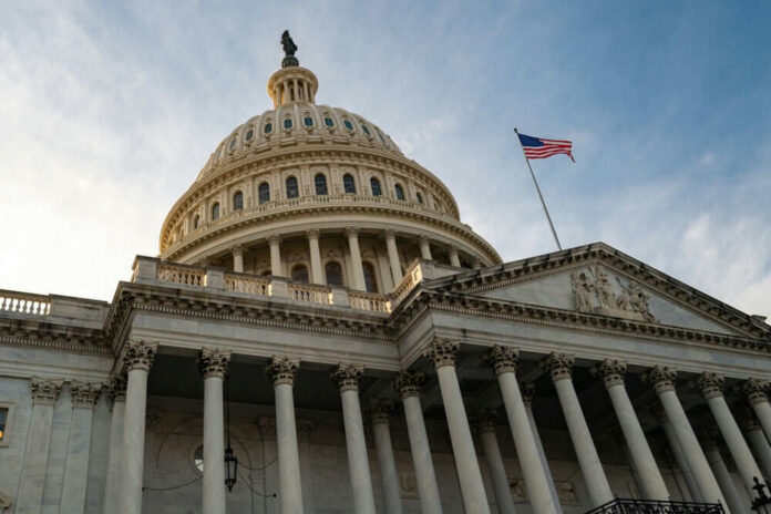 2443980471 US Capitol building with American flag flying above