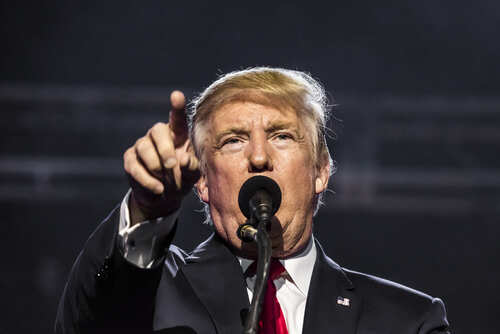 Donald Trump speaking passionately at a rally