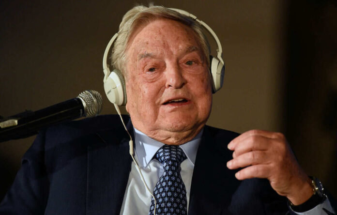 Man wearing headphones speaking into a microphone