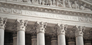 Stone columns with equal justice under law inscription