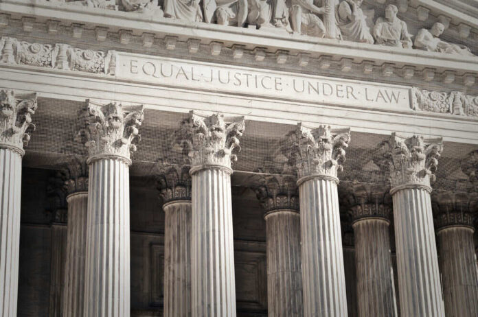 Stone columns with equal justice under law inscription