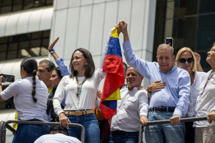 People holding Venezuelan flag during outdoor event
